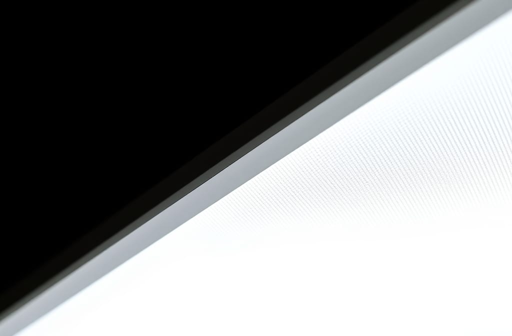 A close-up of a modern LED panel light showing uniform illumination, no text, no watermark, no labels, no writing, no logos